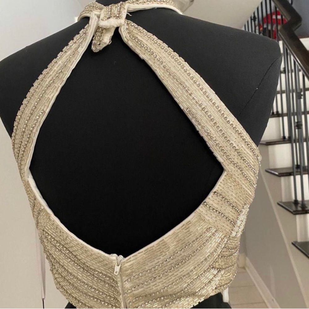 gorgeous hand beaded top with halter clip and zipper up the back!
